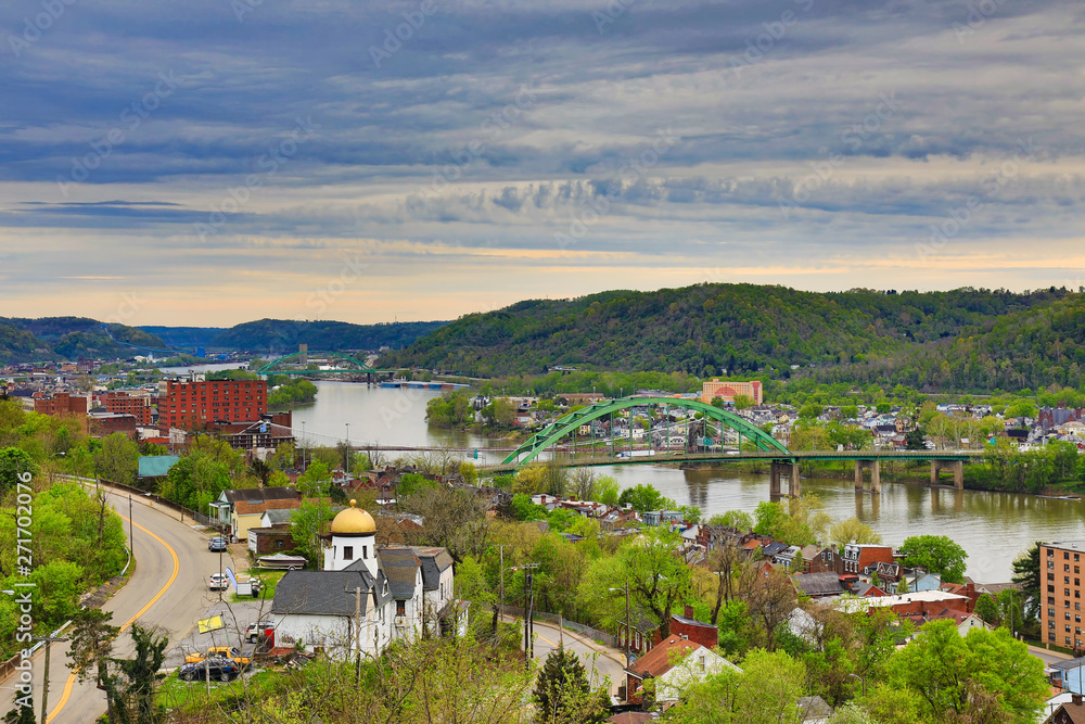 This is an aerial view of Wheeling, West Virginia along the Ohio River.  This skyline cityscape shows Wheeling Island in the distance.
