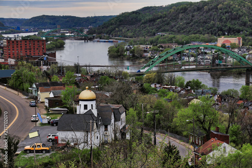 This is an aerial view of Wheeling, West Virginia along the Ohio River.  This skyline cityscape shows Wheeling Island in the distance.