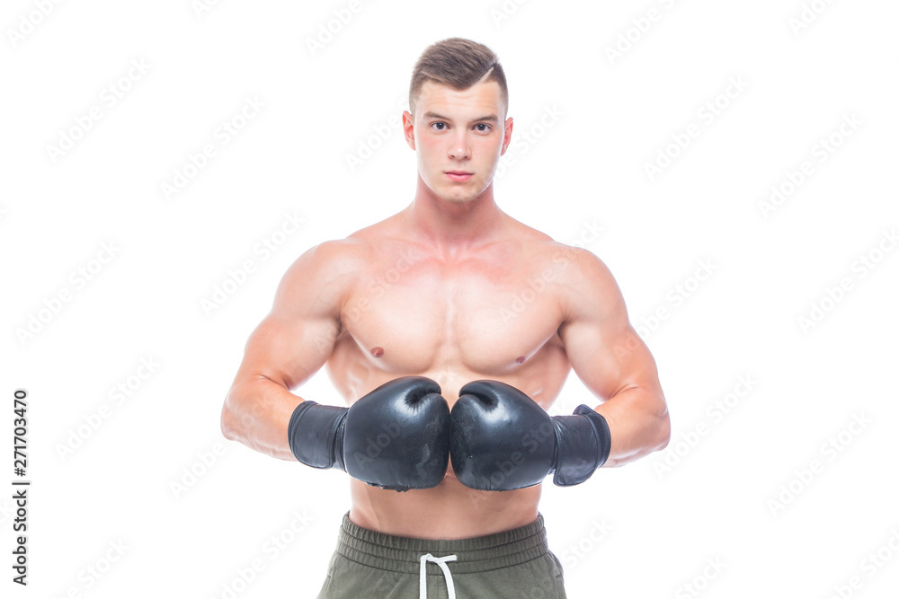 Muscular young man in black boxing gloves and shorts shows the different movements and strikes in the studio on a white background. Strong Athletic Man - Fitness Model showing his perfect body. Copy Muscular young man in black boxing gloves and shorts shows the different movements and strikes in the studio on a white background. Strong Athletic Man - Fitness Model showing his perfect body. Copy