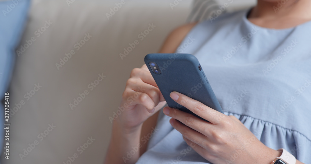 Close up woman use of smart phone at home Close up woman use of smart phone at home