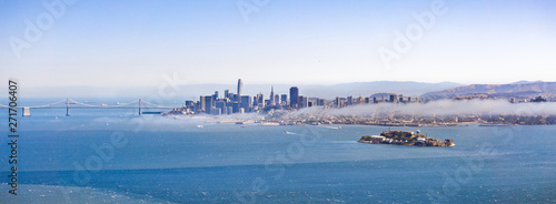 Panoramic view of San Francisco's skyline and Alcatraz Island on a sunny day, California