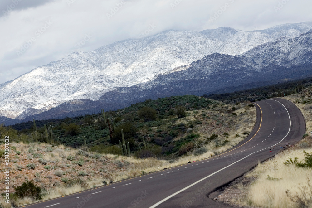 Fototapeta premium road into the snowy mountains