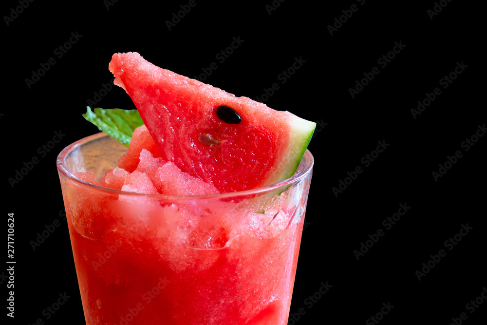 red watermelon juice with ice and green mint leaf for summer drink refreshment on black background red watermelon juice with ice and green mint leaf for summer drink refreshment on black background