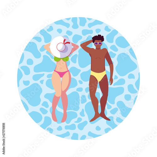 interracial couple with swimsuit floating in water © djvstock