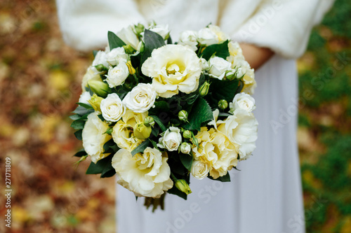 Wedding bouquet made of white roses on a natural background
