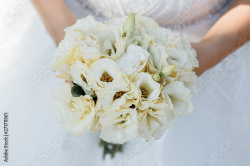 Wedding bouquet made of white roses on a natural background