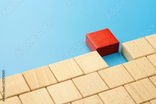 Wooden blocks connected on a blue background, Business team building concept