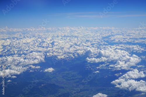Aerial view of the Alps Mountains covered with snow over France and Switzerland