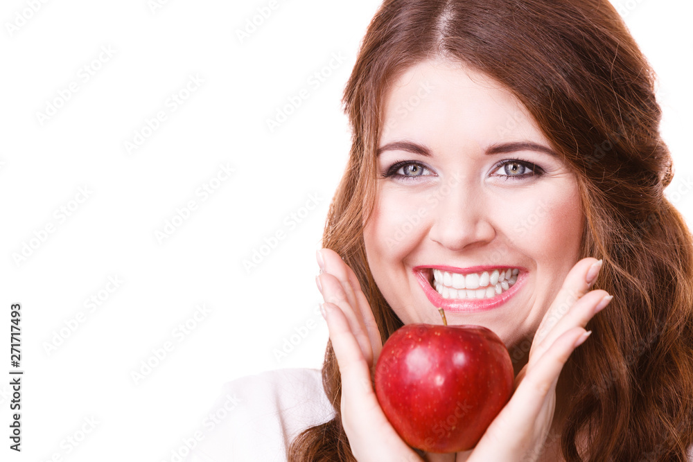 Woman holds apple fruit close to face, isolated Woman holds apple fruit close to face, isolated