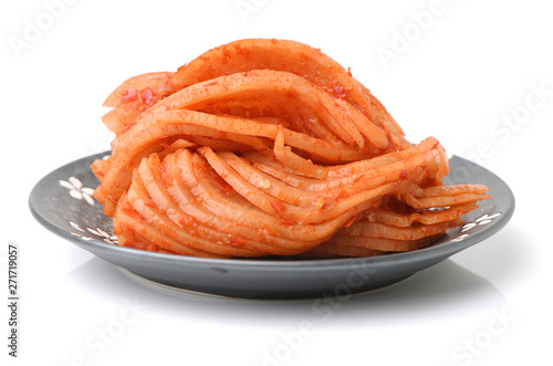 sliced radish kimchi on white background