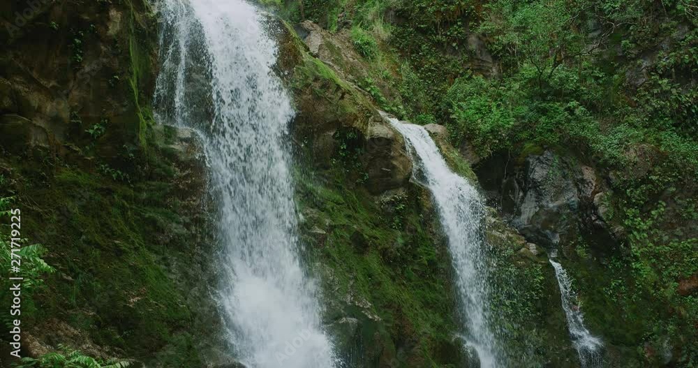 Amazing waterfall in the jungle, three waterfalls flowing in slow motion, jungle adventure vacation Amazing waterfall in the jungle, three waterfalls flowing in slow motion, jungle adventure vacation