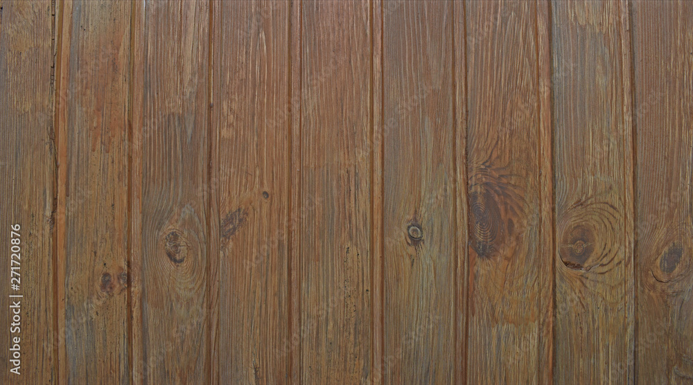 Natural wooden background. Surface of wooden texture for design and decoration. Shabby vertical boards with peeling paint. Brown color. Copy space. Natural wooden background. Surface of wooden texture for design and decoration. Shabby vertical boards with peeling paint. Brown color. Copy space.