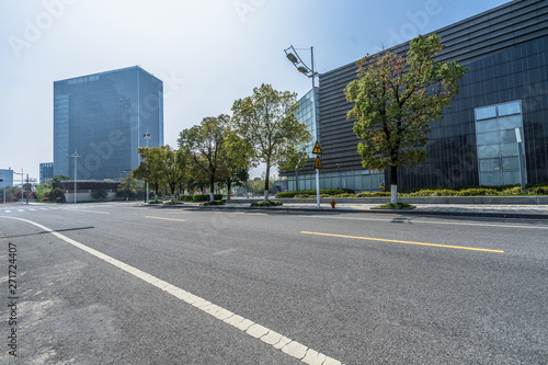 empty asphalt road front of modern buildings.