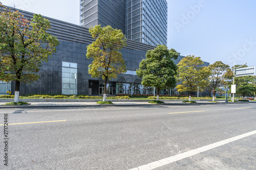 empty asphalt road front of modern buildings.