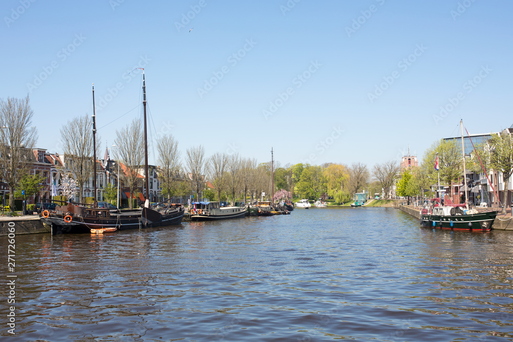View of the Wester Stadsgracht (west city canal) seen from the Willemskade, the old wall of the Frisian city of Leeuwarden, The Netherlands.