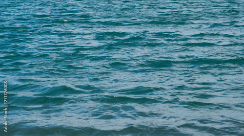 closeup of little waves on the lake surface texture