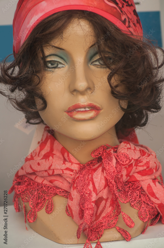 closeup of woman face of mannequin with wig in fashion store showroom closeup of woman face of mannequin with wig in fashion store showroom