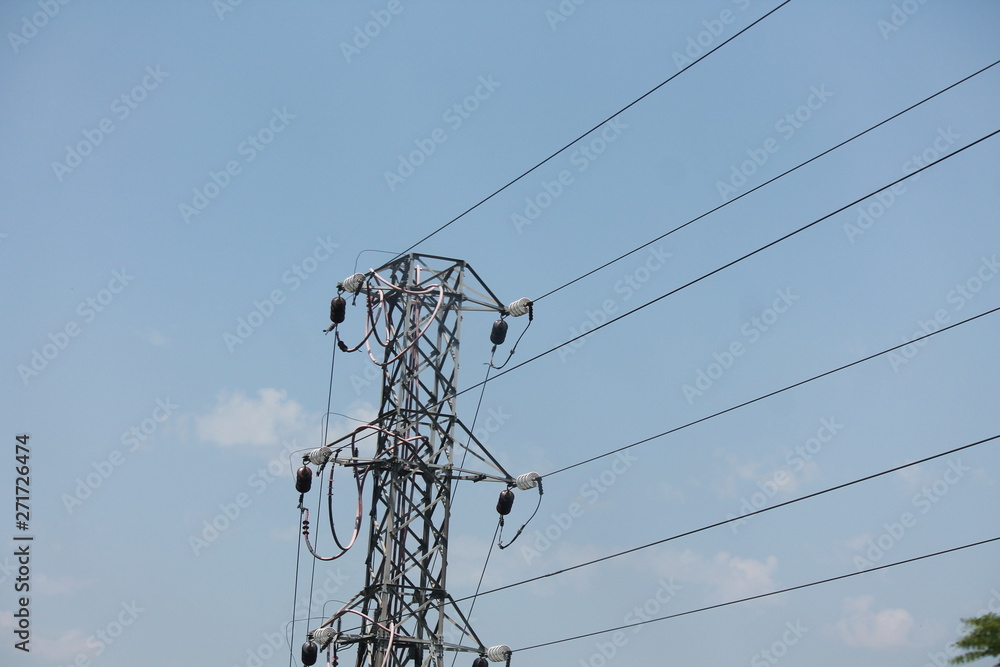 High power electricity poles in urban area connected to smart grid. Energy supply, distribution of energy, transmitting energy, energy transmission, high voltage supply concept photo High power electricity poles in urban area connected to smart grid. Energy supply, distribution of energy, transmitting energy, energy transmission, high voltage supply concept photo