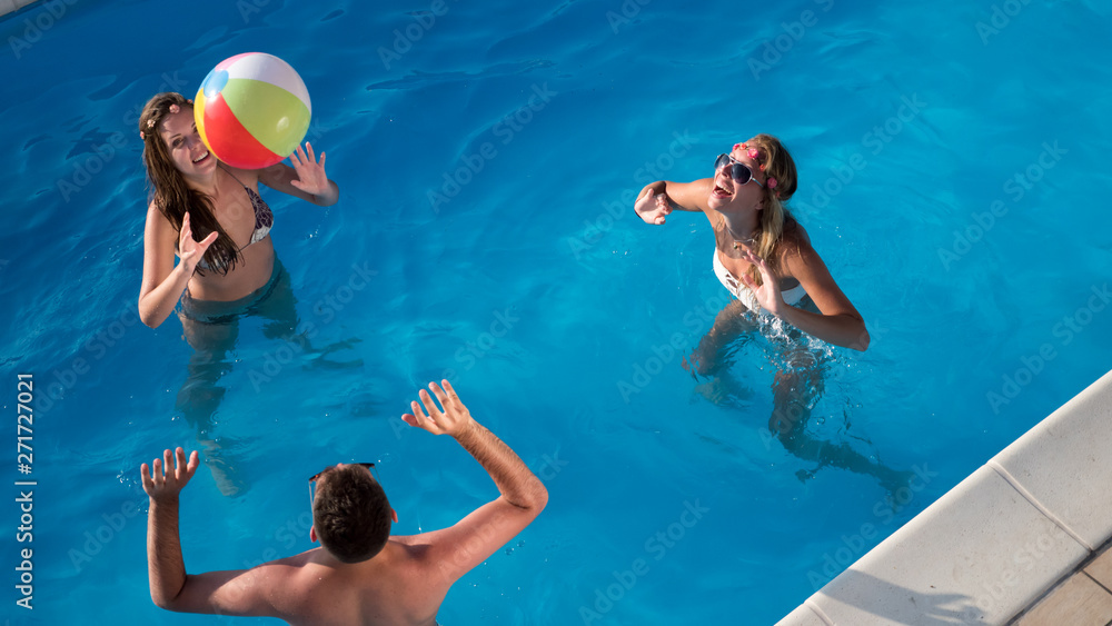 Group of friends partying in pool