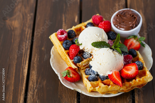 sweet belgian waffles with berries and ice cream