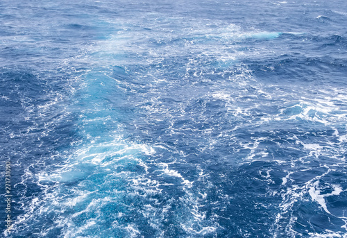 Fototapeta Naklejka Na Ścianę i Meble -  Boat Wave ocean trace on blue sea fresh water background.