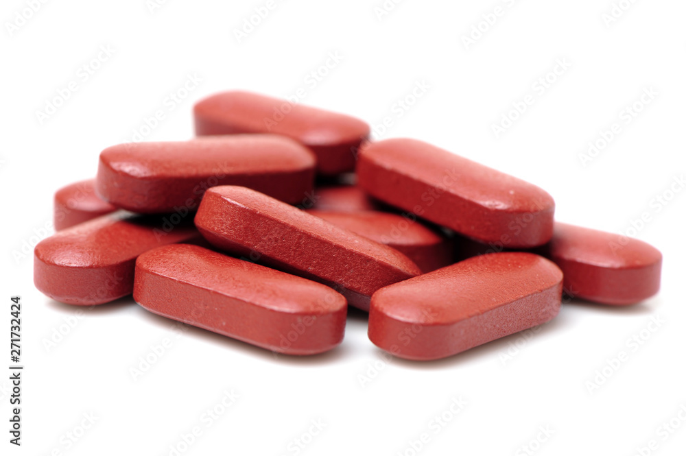 Red pills on a white background Red pills on a white background