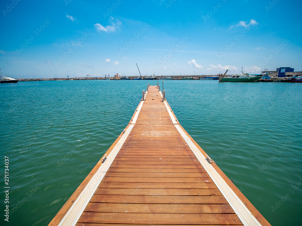 Obraz premium Cambrils pier that ends in the Mediterranean Sea, in Spain