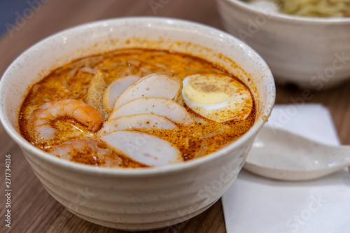 Laksa is a spicy noodle soup popular in Peranakan cuisine of Southeast Asia