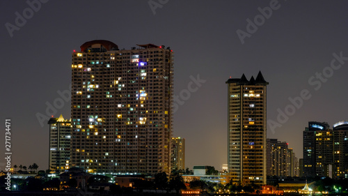 Business architecture  skyscrapers and light trails  Close shot of skyscrapers with lights  Night building.