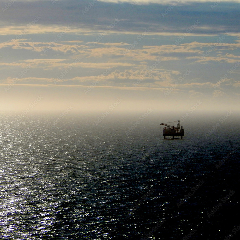 A drilling platform out in the Irish sea at dusk. Taken from the cliffs at st Bees, Cumbria, England