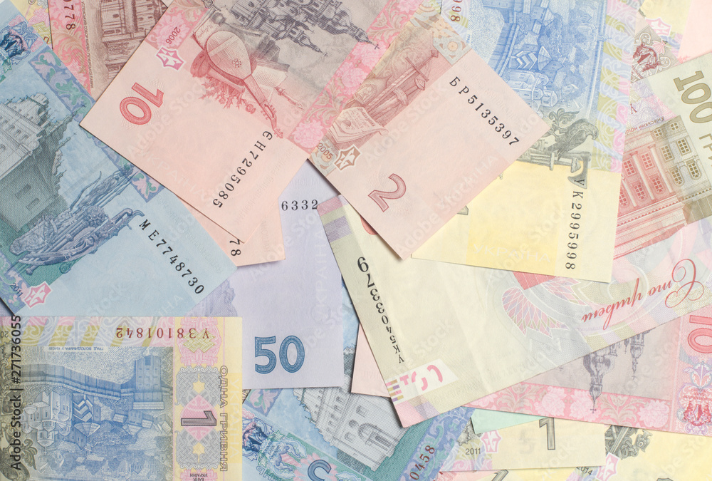 Obraz premium Hryvnia paper bill. Notes in denominations of one, two, five, ten, twenty, fifty and one hundred hryvnia. Cash. Background texture. Ukrainian money.