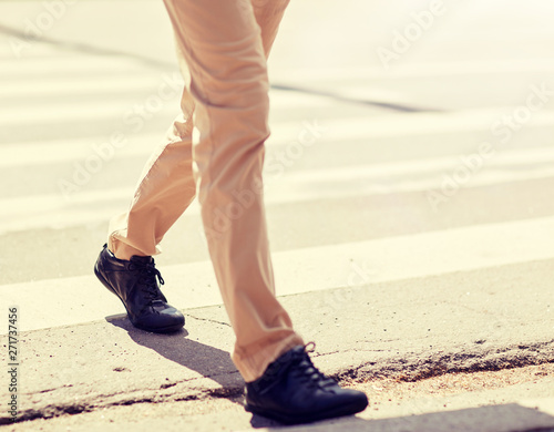leisure and people concept - senior man walking along summer city crosswalk
