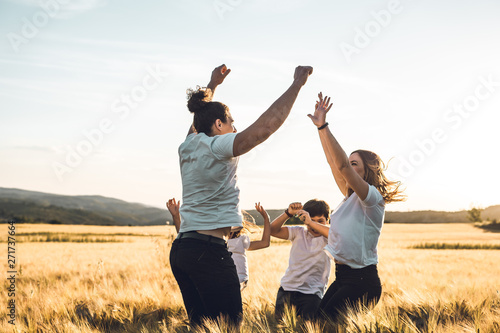 Happy and fun family in nature. Concept of united family having fun and smiling