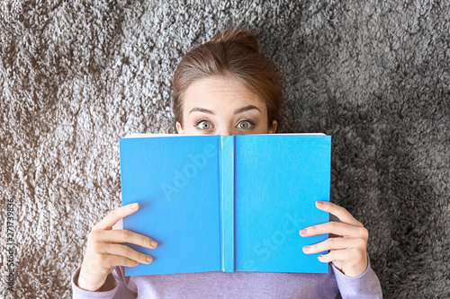 Surprised young woman with ...