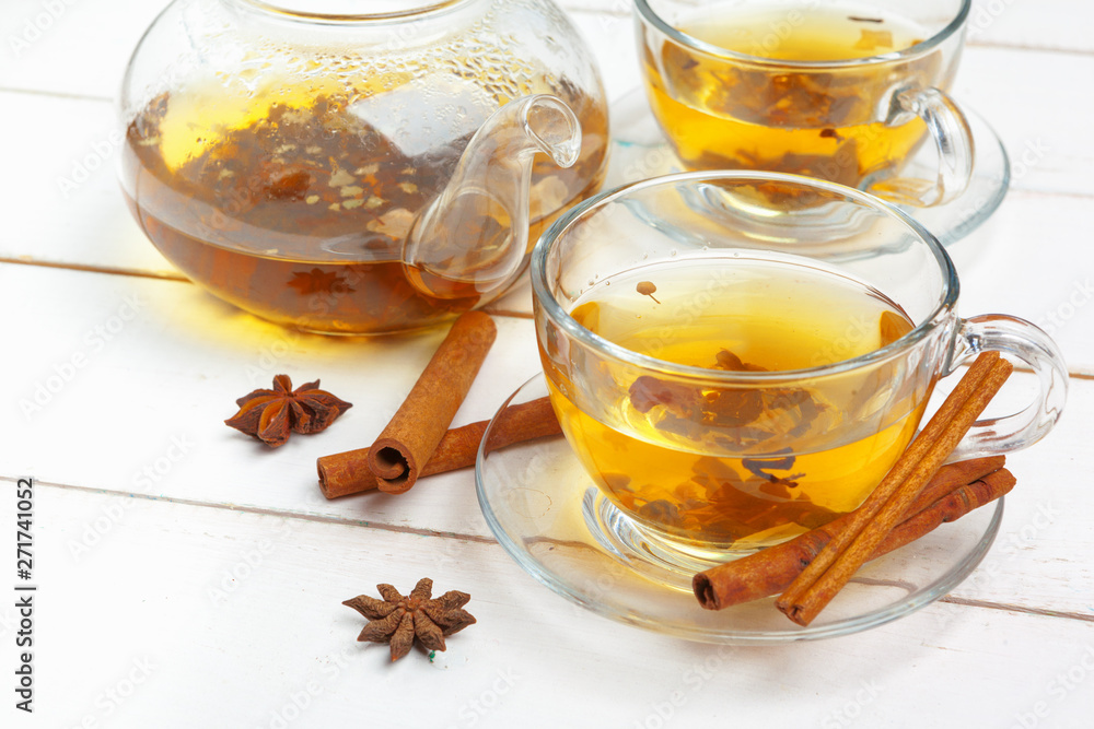 teapot and cups of tea on a white wooden background teapot and cups of tea on a white wooden background