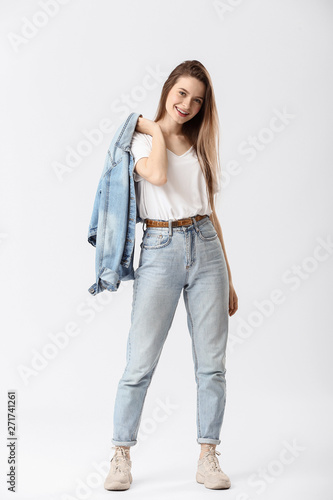 Stylish young woman in jean...