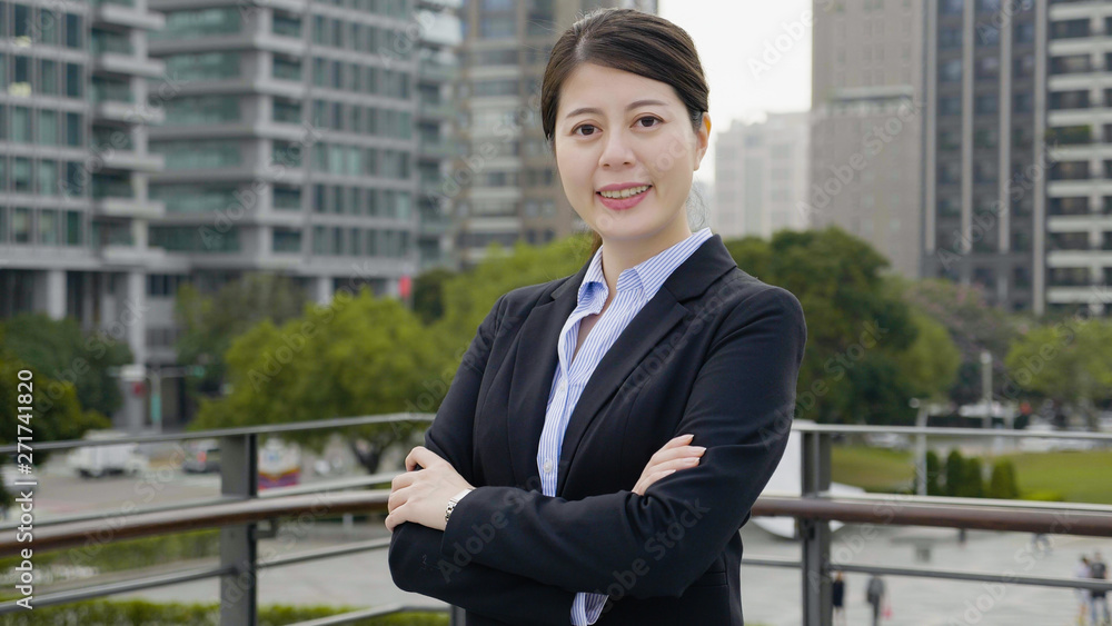 Smiling bank manager welcoming warm personality bright big smile outside office building. confident business woman crossed arms face camera happy looks outdoor on balcony terrace relaxing break time Smiling bank manager welcoming warm personality bright big smile outside office building. confident business woman crossed arms face camera happy looks outdoor on balcony terrace relaxing break time