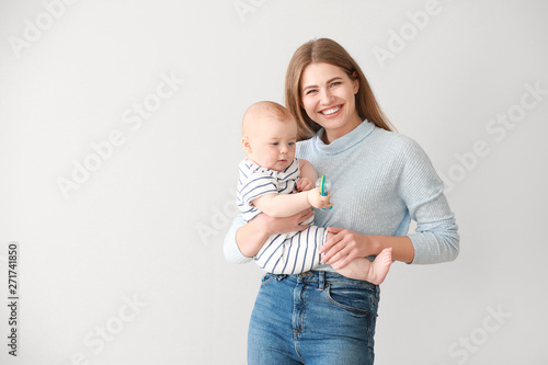 Happy mother with cute litt...