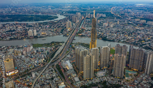 Top View of Building in a City - Aerial view Skyscrapers flying by drone of Ho Chi Mi City with development buildings  transportation  energy power infrastructure.