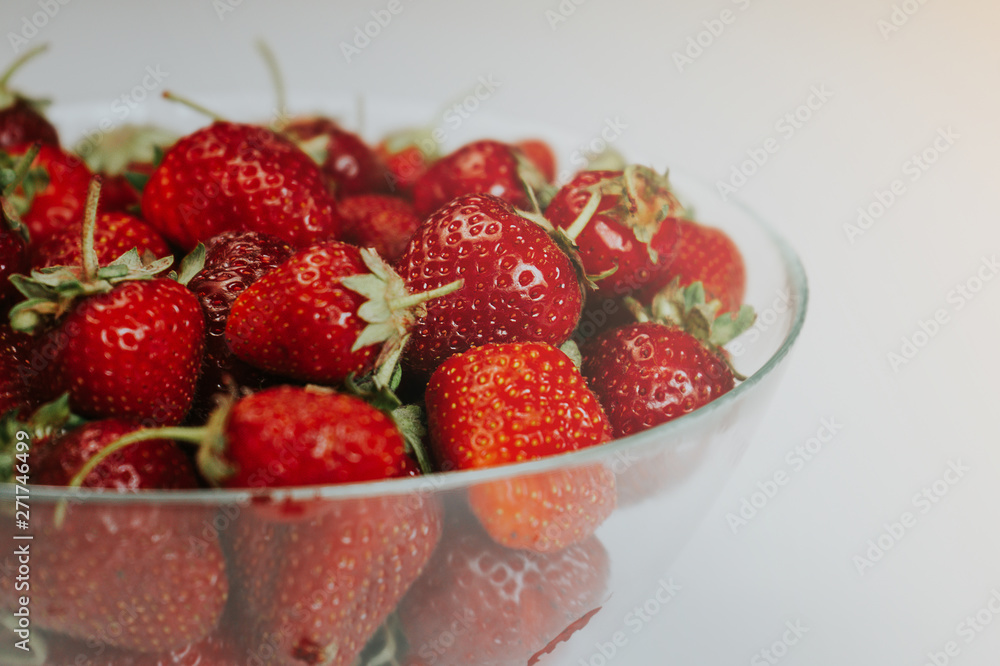 Strawberries in a transparent bowl Strawberries in a transparent bowl