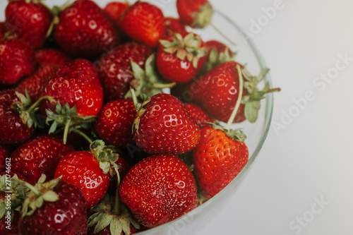 Strawberries in a transparent bowl