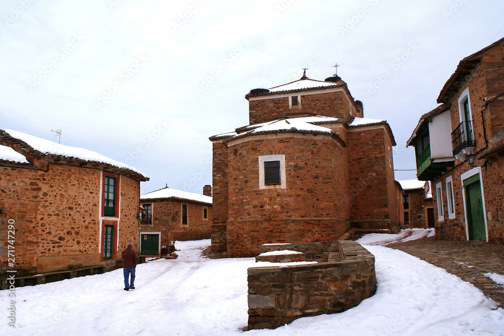 church, street and houses in Castrillo de los Polvazares (spain)