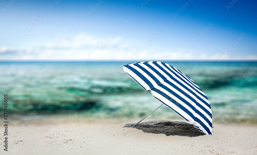 Summer umbrella on beach and free space for your decoration. Summer umbrella on beach and free space for your decoration.