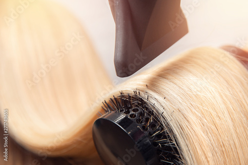 Close-up of hair dryer, concept cut salon, female stylist