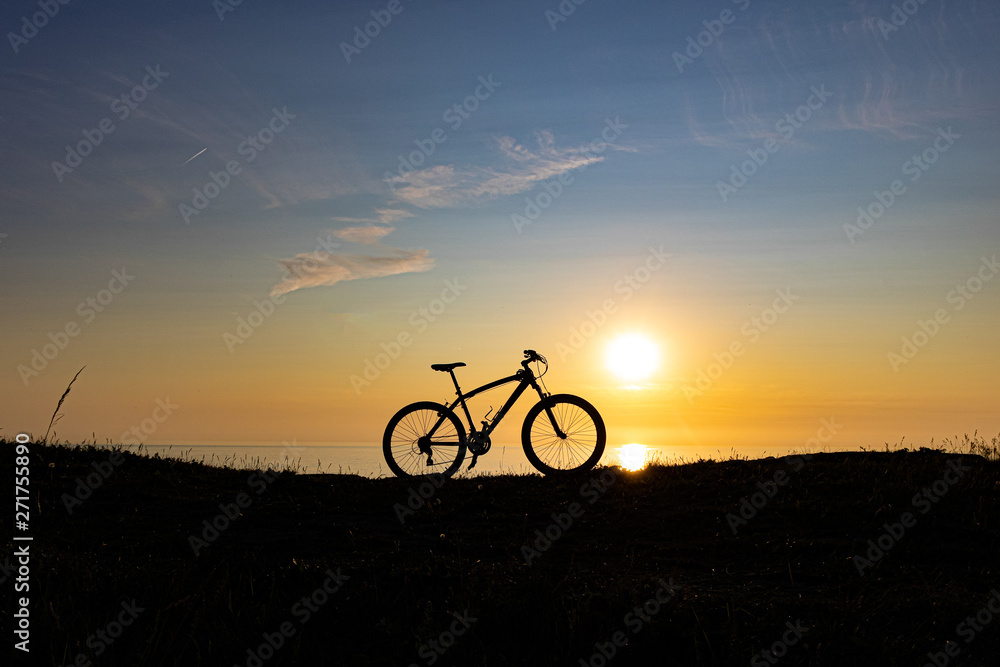 beautiful sunset on the sea and the silhouette of a bicycle beautiful sunset on the sea and the silhouette of a bicycle