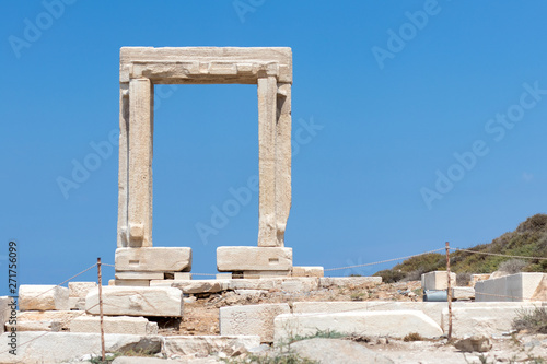 Temple of Apollo ancient ruins in Naxos island, Cyclades, Greece. Famous landmark of Portara in Chora Town, main port.