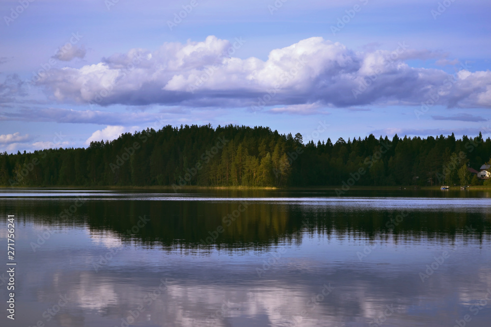 Landscape with lake, blue sky, beautiful clouds and reflection in the water Landscape with lake, blue sky, beautiful clouds and reflection in the water