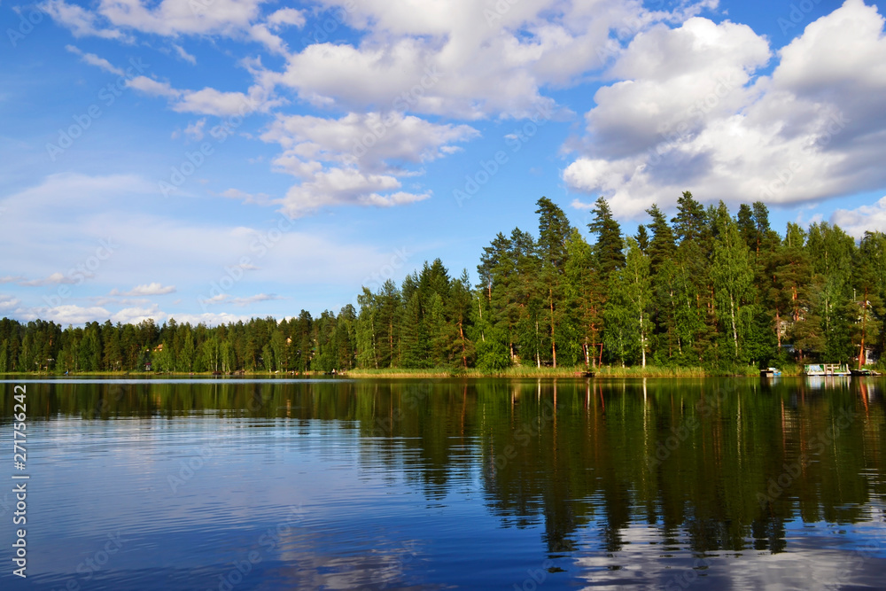 Landscape with lake, blue sky, beautiful clouds and reflection in the water Landscape with lake, blue sky, beautiful clouds and reflection in the water