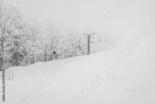 Ski lift over snow mountain in ski resort .