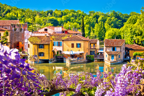 Mincio river and idyllic village of Borghetto view photo